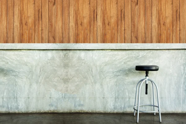 Elegant chair in an empty concrete room. — Stockfoto