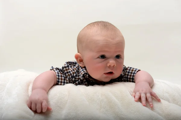 Happy 2 month old baby lifting head up — Stock Photo, Image