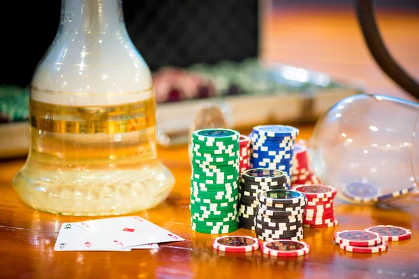 Chips for poker and hookah on the table — Stock Photo, Image