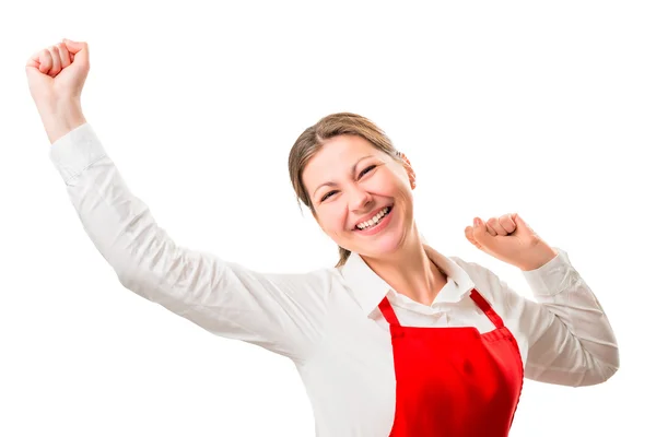 Mulher bonita alegre em um avental vermelho em um fundo branco se alegrar — Fotografia de Stock