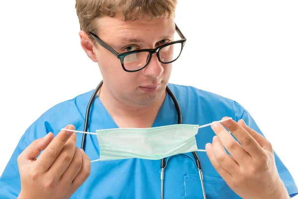 Portrait of a surgeon preparing for surgery on a white backgroun — Stock Photo, Image