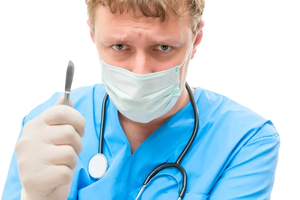 Evil and crazy surgeon in the mask on a white background — Stock Photo, Image