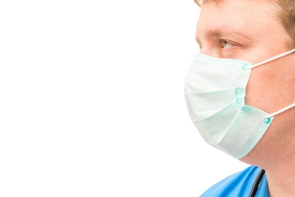 Mask on the face of the surgeon and space for lettering close-up — Stock Photo, Image