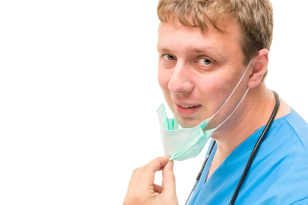Young professional surgeon pulled the mask from the face — Stock Photo, Image