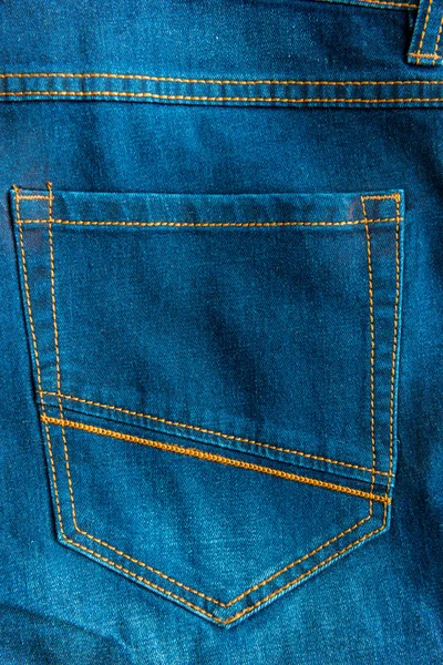Back pocket of blue jeans close-up — Stock Photo, Image