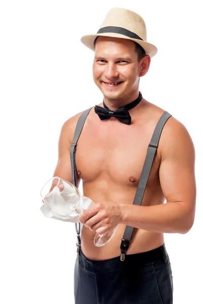 Happy waiter with a clean glass in hand on white background — Stock Photo, Image