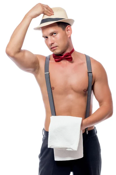 Garçom stripper com um torso nu tira o chapéu — Fotografia de Stock