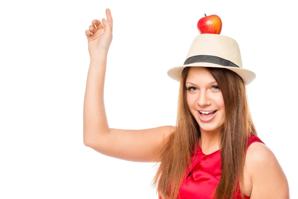 Veselá dívka s červené jablko na hlavu na bílém pozadí — Stock fotografie