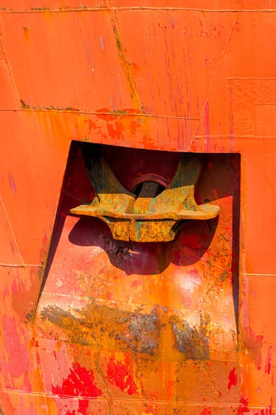 rusty red ship anchor close-up