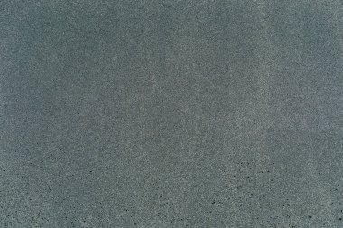 Siyah renkli volkanik kum yüzeyinin makro görüntüsü