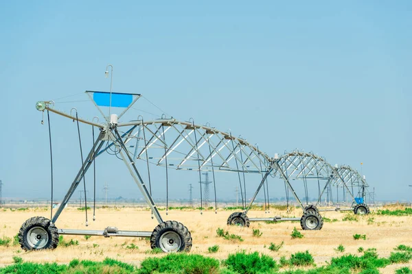 Irrigate Sprayer working in a field of Farm