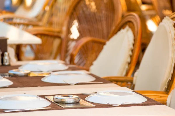 Laid tables in a summer cafe in the resort — Stock Photo, Image