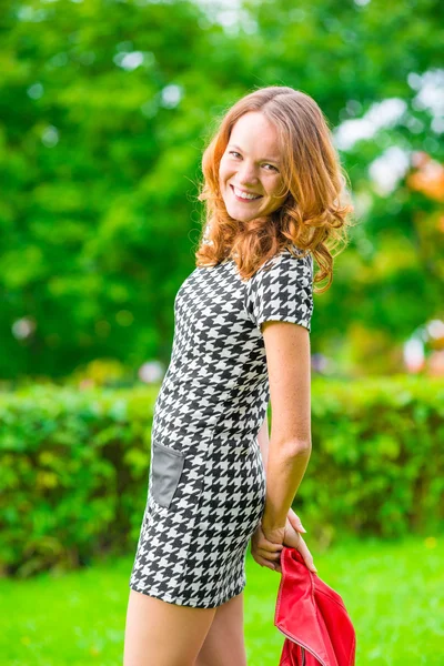 Portrait of a cheerful girl with red hair — Stock Photo, Image