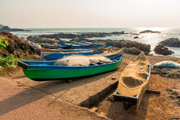 Fishing boats with nets by the ocean — Stock Photo, Image