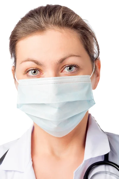 Chirurgo donna in maschera medica sul suo viso su uno sfondo bianco — Foto Stock