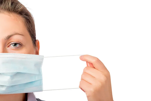 Female face close-up and medical mask isolated — Stock Photo, Image