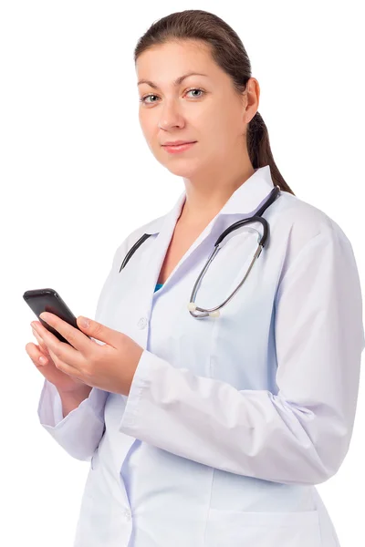Retrato de una mujer vestida de médico con teléfono —  Fotos de Stock