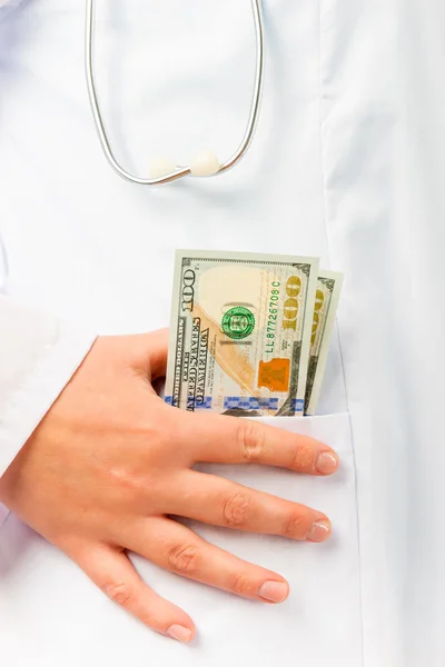 Bribe in the pocket Doctor close-up — Stock Photo, Image