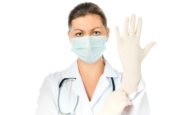 Woman surgeon preparing for surgery put on gloves — 图库照片