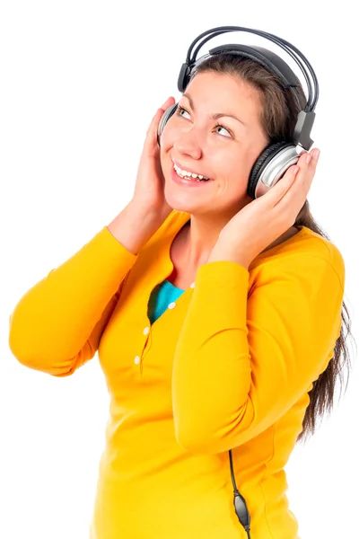 Happy girl listening to music in the studio on a white backgroun — Stok fotoğraf