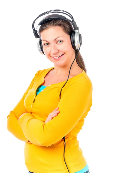 Brunette on white background with headphones — Stok fotoğraf