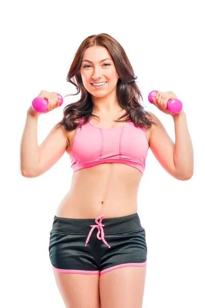 Portrait of a beautiful trainer with dumbbells on a white backgr — Stock Photo, Image