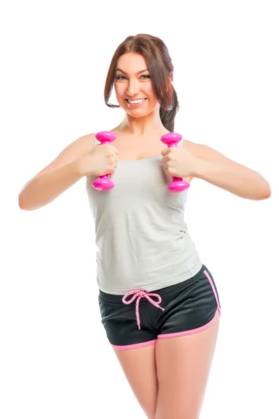 Portrait of a brunette with pink dumbbells — Stock Photo, Image