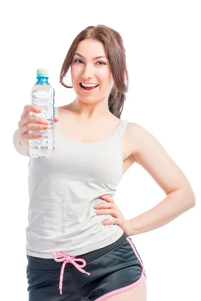 Happy girl holds a bottle of drinking water — Stock Photo, Image