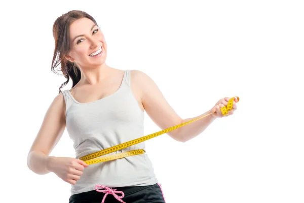 Positive schlanke Mädchen mit Zentimeter an der Taille — Stockfoto