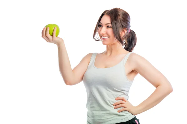 Портрет девушки с зеленым яблоком на белом фоне — стоковое фото