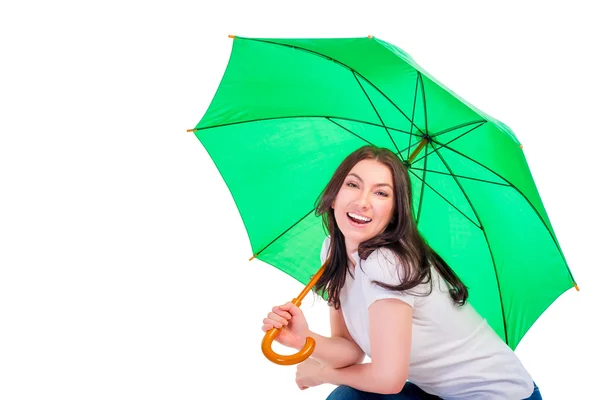 Brünette mit grünem Regenschirm — Stockfoto