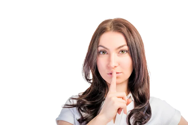 Closeup portrait of a girl with finger on lips — Stock Photo, Image