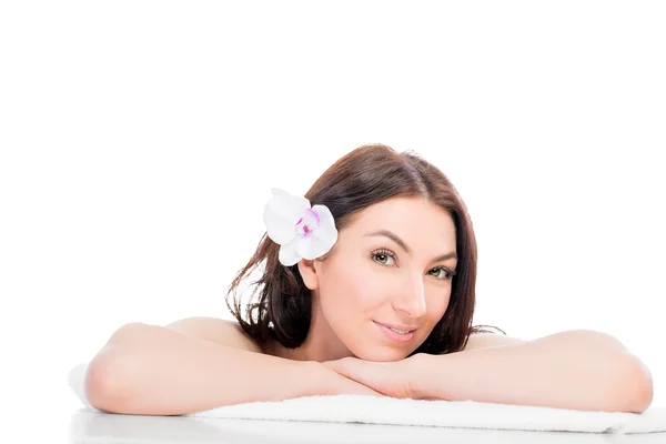 Girl on a bath towel posing on a white background — Stock Photo, Image
