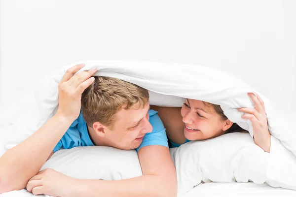 A loving couple was covered with a blanket — Stock Photo, Image