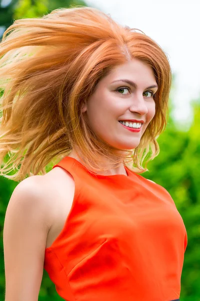 Portrait of a cheerful girl in a jump — Stock Photo, Image