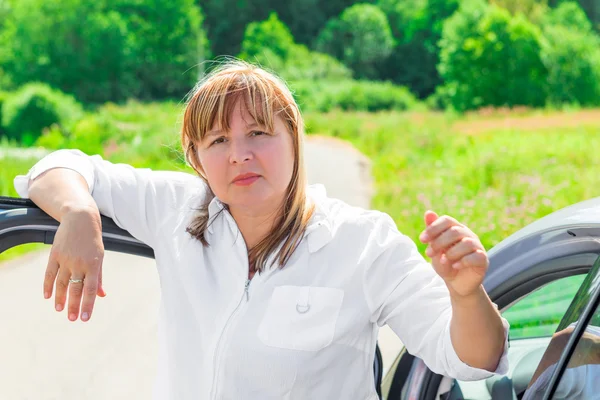 Mature driver near her beloved car — Stock Photo, Image