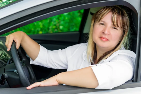 Driver woman of 50 years with a beautiful smile — Stock Photo, Image