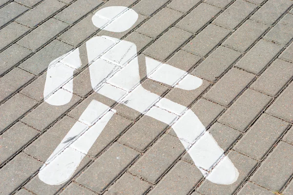 Man sign white color on the sidewalk — Stock Photo, Image