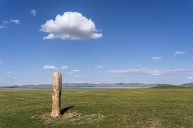 Deer standing stone on the steppe of Mongolia near Songino. clipart