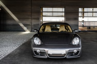 Kyiv, Ukraine - April 4th, 2014: Photoshoot of Porsche Cayman near automotive center 