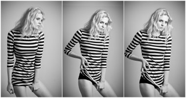 çekici sarışın seksi siyah beyaz dar elbise kışkırtıcı kapalı poz uygun. Klasik bir boudoir sahne bir duvara şehvetli kadın portresi. güzel sarı saçlar kadın, kapalı atış.