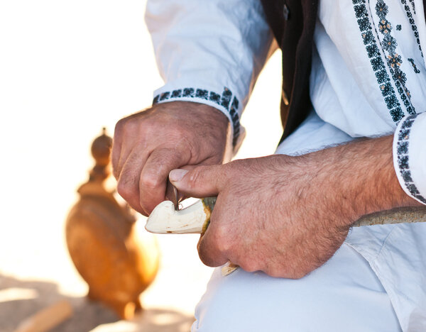 Worker wood craftsman, an artisan detail, tradition and old work. Romanian artisan male hands working. Sculptor representing traditional culture in Romania.