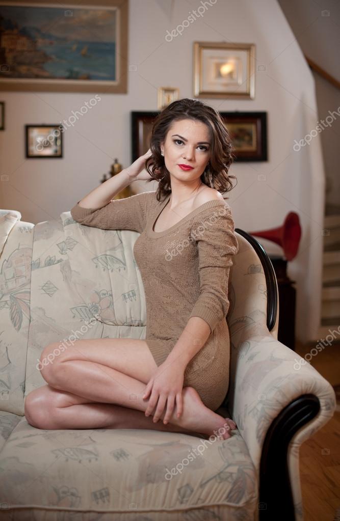 Young Sensual Woman Sitting On Sofa Relaxing Beautiful Long Hair Girl With Comfortable Clothes
