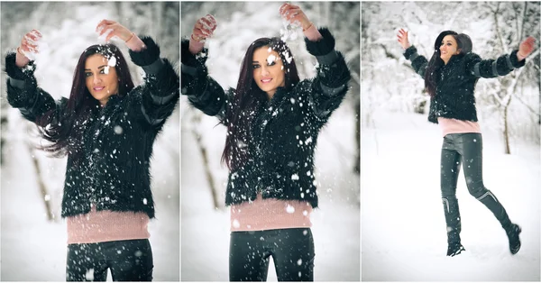 Vista de la chica morena feliz jugando con la nieve en el paisaje de invierno. Hermosa joven hembra sobre fondo de invierno. Atractiva mujer joven en ropa caliente y suave al aire libre en un día de invierno —  Fotos de Stock