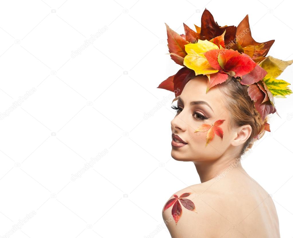 Autumnal woman. Beautiful creative makeup and hair style in fall ...