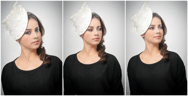 Penteado e compõem - belo retrato de arte jovem. Morena bonito com tampa branca e véu, tiro estúdio. Mulher atraente com belos lábios e olhos em blusa preta, sobre branco — Fotografia de Stock