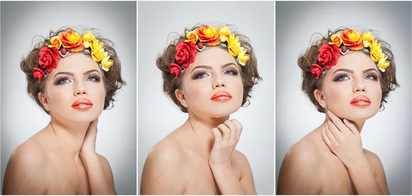 Portrait de belle fille en studio avec des roses jaunes et rouges dans les cheveux et les épaules nues. Jeune femme sexy avec un maquillage professionnel et des fleurs lumineuses. Coiffure créative et maquillage, plan studio — Photo