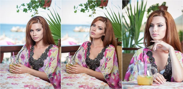 Attractive red hair young woman with bright colored blouse drinking lemonade on a terrace having blue sea in background. Gorgeous redhead model drinking fresh drink with straw in a summer day — Stock Photo, Image