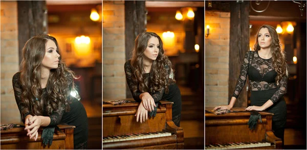 Joven mujer morena hermosa en vestido negro elegante de pie cerca de un piano vintage. Señora romántica sensual con el pelo largo y oscuro en el interior de lujo, soñando despierto. Chica atractiva posando en el interior — Foto de Stock