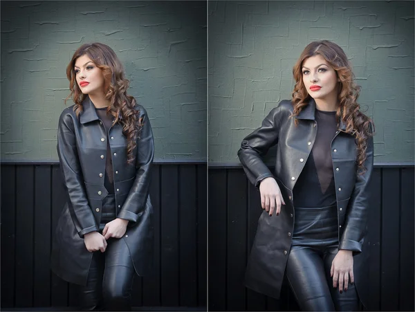 Charming young brunette woman in black leather outfit, coat and trousers, with dark gray wall on background. Sexy gorgeous young woman. Full length portrait of a sensual woman with long curly hair — Stock Photo, Image